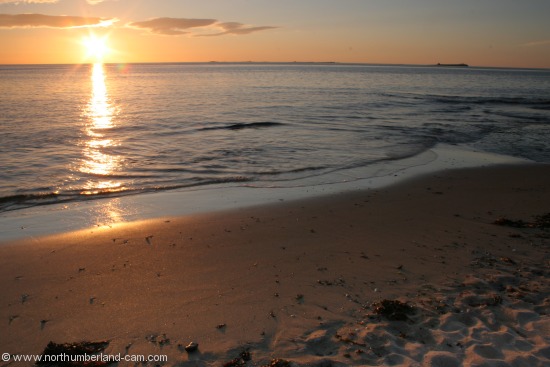 Summer sunrise at Bamburgh Beach.