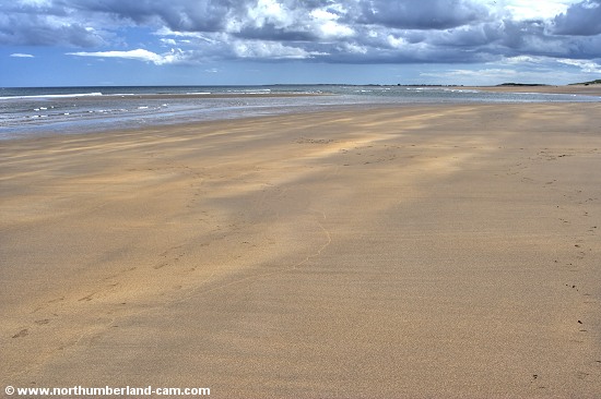 Vew south along the vast beach at Cheswick Sands.