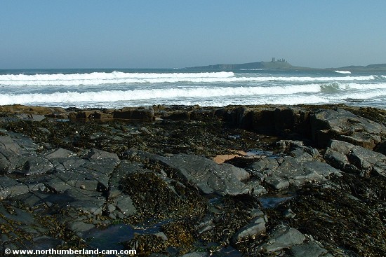 View across the bay to Dunstanburgh Castle.
